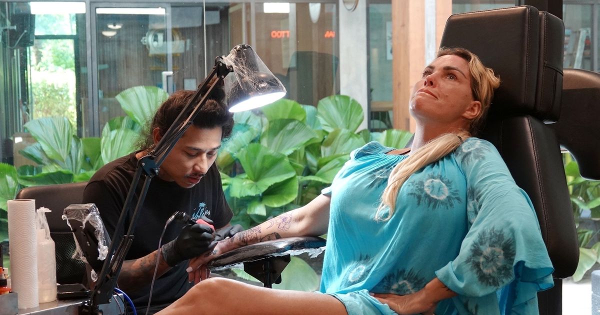 Katie Price holds back tears as she gets biggest tattoo yet after unveiling new boobs