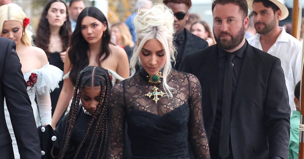 Kim Kardashian channels goth chic in tight black lacy gown for Kourtney’s wedding