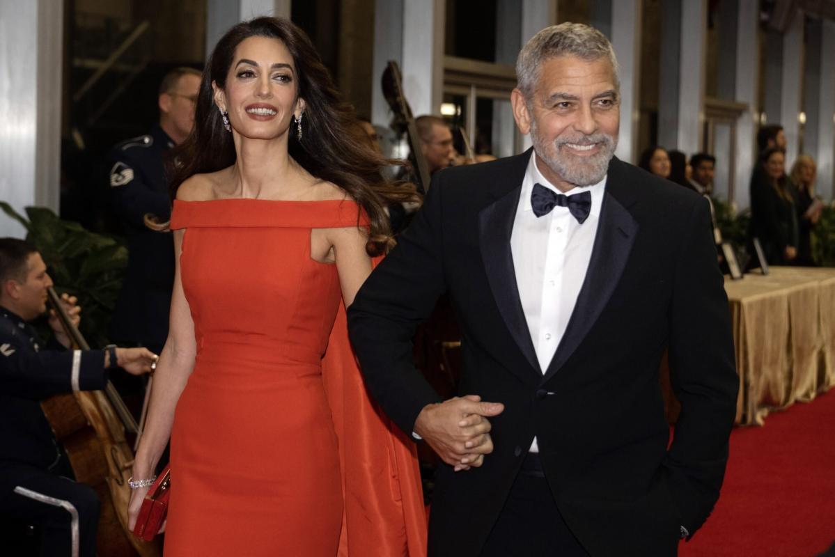 George Clooney Fixes Wife Amal’s Dress Train While on Kennedy Center Honors Red Carpet