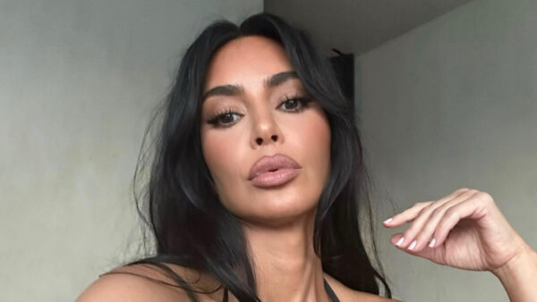 Kim Kardashian busts right out of tiny black triangle bikini top and flaunts her massive pout in very sexy new selfies