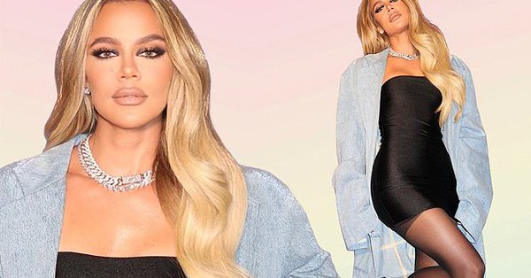 Khloe Kardashian is all legs as she styles a skintight LBD with a baggy denim trench coat for her clothing line https://t.co/n7Qn3HJdEV