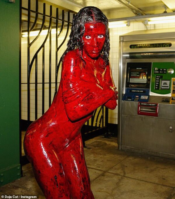 Doja Cat shares pics of bloody red Scarlet mannequin at subway station in New York City and releases new single Balut from upcoming album