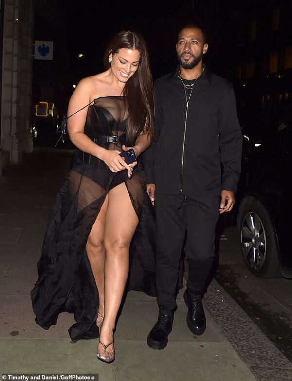Ashley Graham flashes her underwear in a sheer black gown as she attends Perfect Magazine x Valentino LFW party with husband Justin Ervin