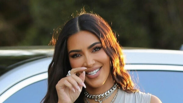 Kim Kardashian flaunts shrinking frame & tiny waist in crop top with matching snake skin pants on her way to Skims shoot