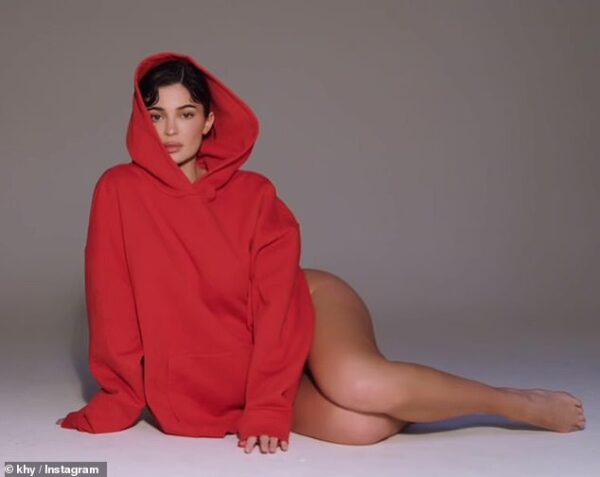 Kylie Jenner dares to bare as she goes without pants while modeling oversize red hoodie for her brand Khy