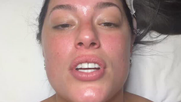 Ashley Graham goes topless under towel as she lies on massage bed and gets cosmetic procedure at NYC spa