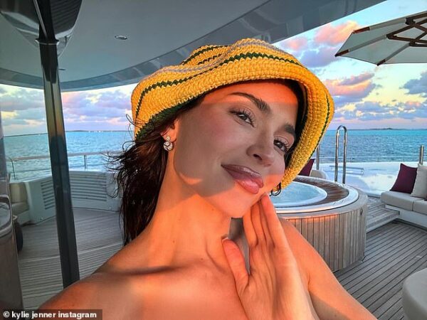 Kylie Jenner rings in the New Year on a yacht at a tropical destination… as the star poses for vacation selfies