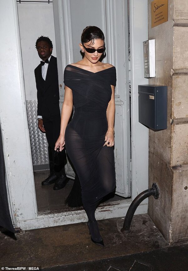 Kylie Jenner exudes glamour in a sheer black dress as she departs Siena Restaurant in Paris after enjoying a luxurious dinner during PFW