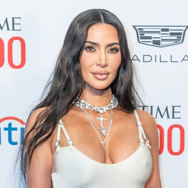 Kim Kardashian Poses In A Chic Iridescent Purple Minidress While Fans Worry That She’s ‘Too Skinny’