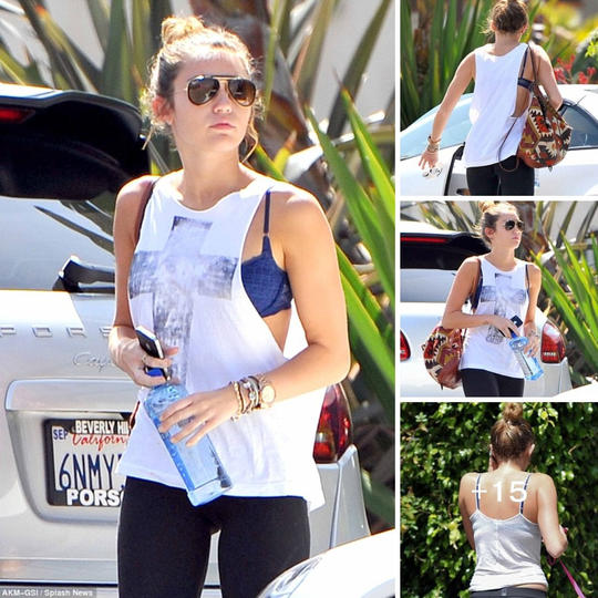 Pop star Miley Cyrus looking radiant in a blue lace bra as she stays fit and fabulous. ‎
