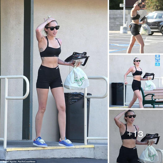 Embracing the fit life with Miley Cyrus!  Check out her killer abs while she slays in athletic wear on a casual lunch da…