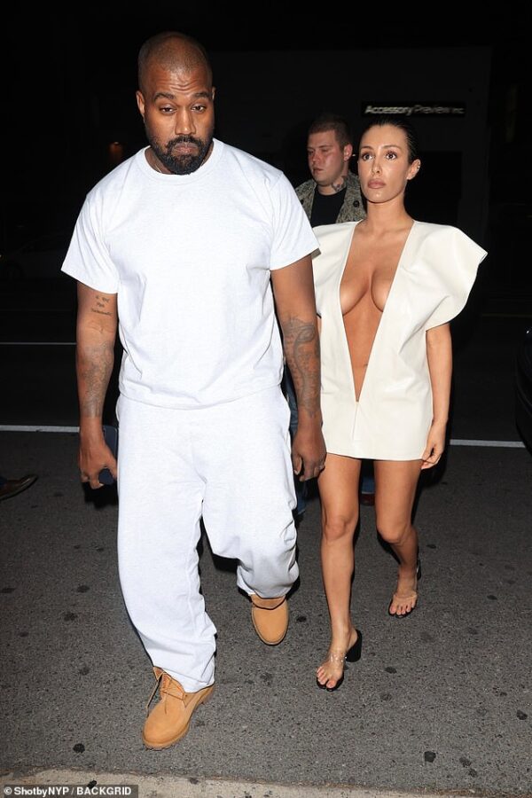 Kanye West’s wife Bianca Censori copies his ex Kim Kardashian AGAIN as she steps out in a plunging white dress previously worn by the reality star