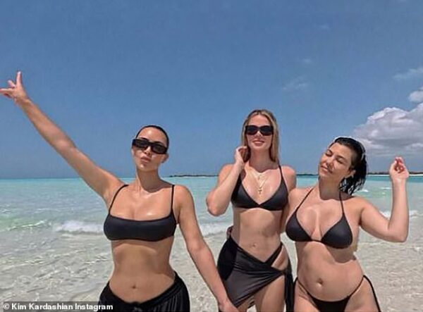 Kourtney Kardashian defends sister Kim after fans accused her of posting ‘shady’ bikini snap for birthday tribute – as she embraces her postpartum figure: ‘I LOVE this body’