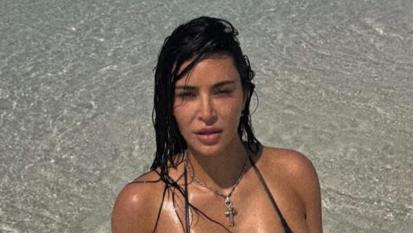 Kim Kardashian baffles fans as she dives in ‘knee-deep water’ for new bikini photos from tropical vacation