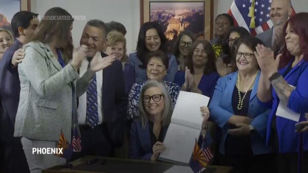 Arizona’s Democratic governor signs a bill to repeal 1864 ban on most abortions