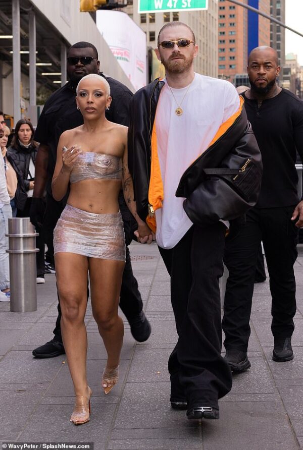 Doja Cat rocks bandeau and micro skirt made of PLASTIC WRAP as she holds hands with Guram Gvasalia during McDonald’s date in NYC