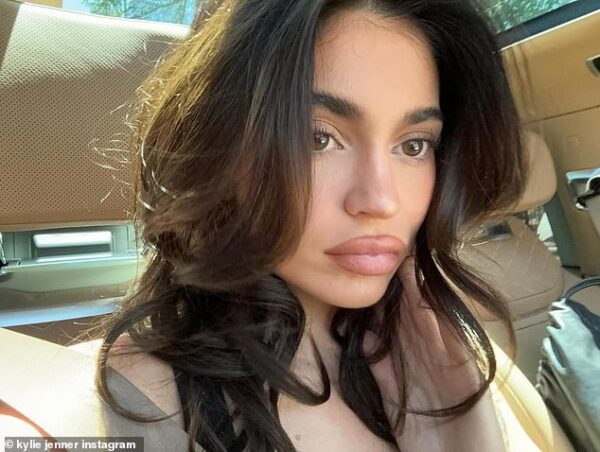 Kylie Jenner shows off a plumper pout while posing up a storm in stylish selfies as she promotes her beauty brand