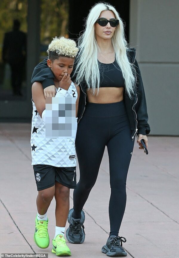 Kim Kardashian matches blonde hair with son Saint, eight, as they arrive at his basketball game… with ex Kanye West sneaking in separately