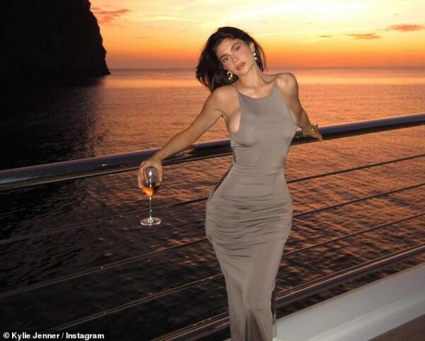 Kylie Jenner wows her fans with sultry sunset photos in a figure-hugging taupe dress from Mallorca vacation with mom Kris and sister Kendall