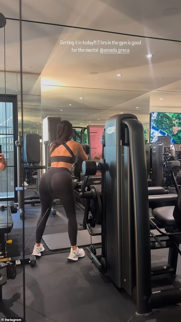 Kim Kardashian shows off her derriere during TWO hour workout with her trainer… before sharing busty glam selfie