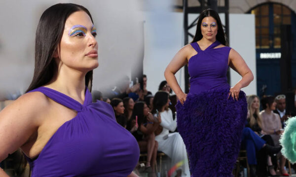 Ashley Graham wears quirky furry purple dress and bold 70s makeup as she walks the runway at Vogue World Paris