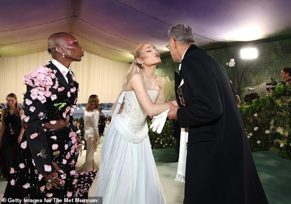 The strangest Met Gala photo yet! Ariana Grande goes in for an air kiss with Jeff Goldblum as Cynthia Ervio puckers up waiting for her smooch