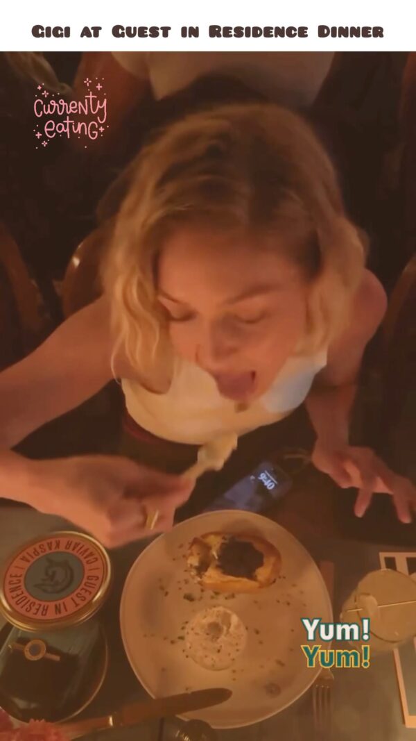 Gigi eating at Guest in Residence Dinner 🤎