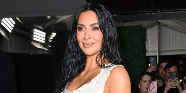 Kim Kardashian Shares Selfies in Vinyl Plunging Top