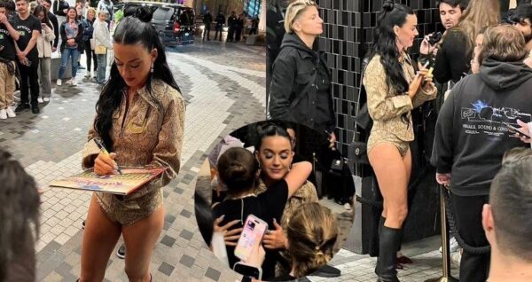 Katy Perry sweetly hugs a young fan as she signs autographs outside her Melbourne hotel after her AFL Grand Final headlining gig…